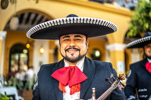 Portrait of mid adult man traditional mariachi at the historic district