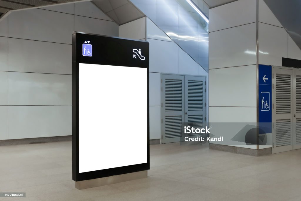 Blank mock up for vertical poster advertising; 6 sheet digital display in MRT station; OOH out of home template Blank mock up for vertical poster advertising; 6 sheet digital display in MRT station; OOH out of home template. Shopping Mall Stock Photo