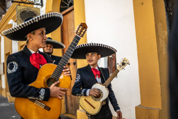 istock Group of traditional mariachis walking along the historic district 1472101801