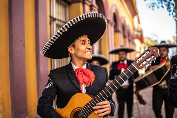 istock Group of traditional mariachis walking along the historic district 1472101859