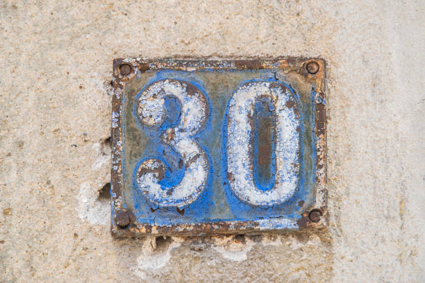 istock Old retro cast iron plate number 30 1472101891