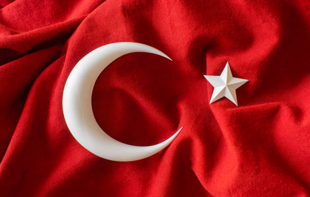 istock Turkish flag, 3d moon and star on red fabric 1472102025