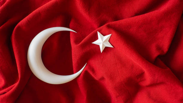 istock Turkish flag, 3d moon and star on red fabric 1472102030