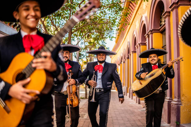 istock Group of traditional mariachis walking at the historic district 1472102432