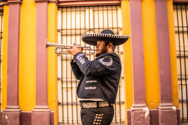 istock Traditional mariachi trumpeter playing at the historic district 1472103728