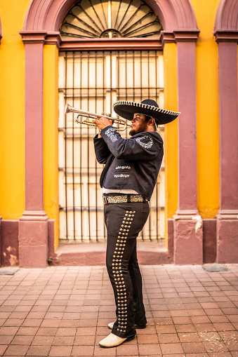 Traditional mariachi trumpeter playing at the historic district