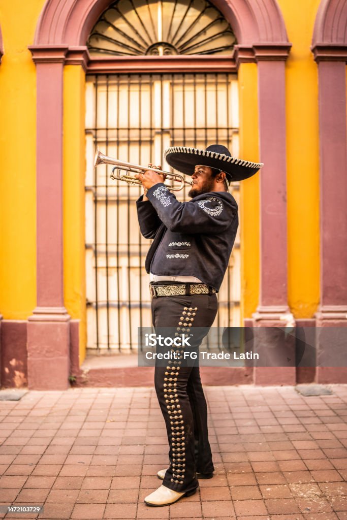 Traditional mariachi trumpeter playing at the historic district Mariachi Stock Photo