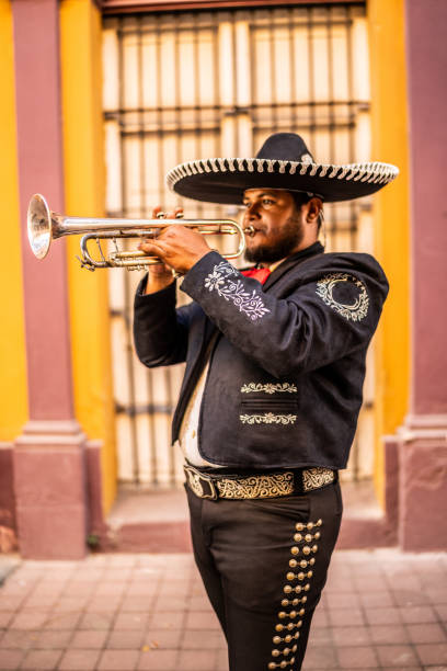 istock Traditional mariachi trumpeter playing at the historic district 1472103733