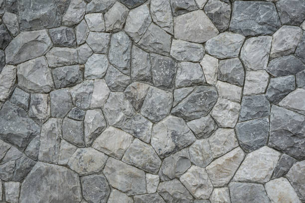 istock Background of unshape stone or rock wall 1472104362