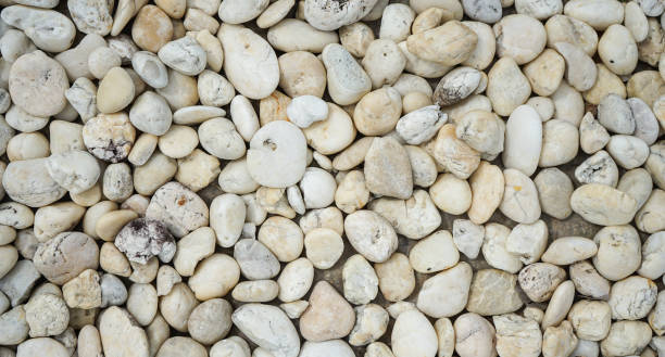 istock White pebbles stone or river stone  background with vintage filter 1472104367
