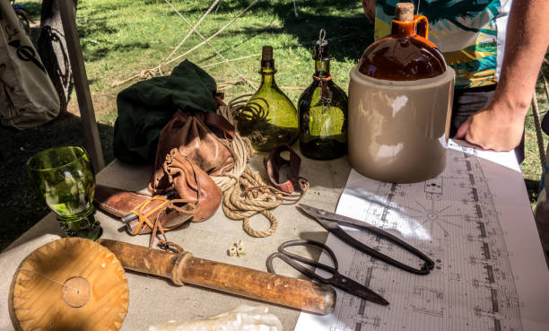 istock Camp table with an old and antique objects outdoors 1472104465