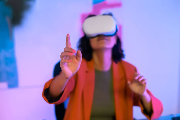istock Close-up of woman's hand moving in air, having VR experience 1472104542