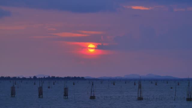 Thai style fishing trap in thailand. Beautiful evening twilight sky