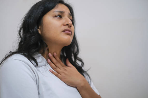 istock Mid Adult Woman With Thyroid Gland Problems 1472105837