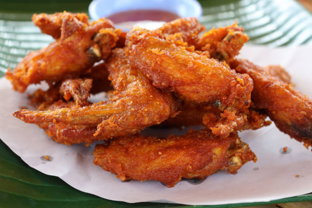 istock Closed up Fried Battered Chicken Wings appetizer cooked in deep fried ready to eat 1472109235
