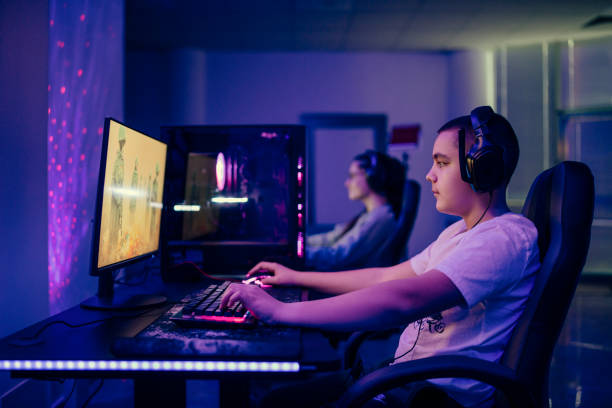 istock Two people competing in a video game tournament. 1472110391
