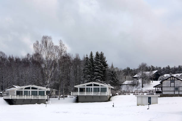 istock Cottages in winter forest with snow, horizontal picture 1472110933