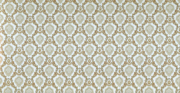 istock Old wallpaper on the wall. Old wallpaper for texture or background. 1472114195