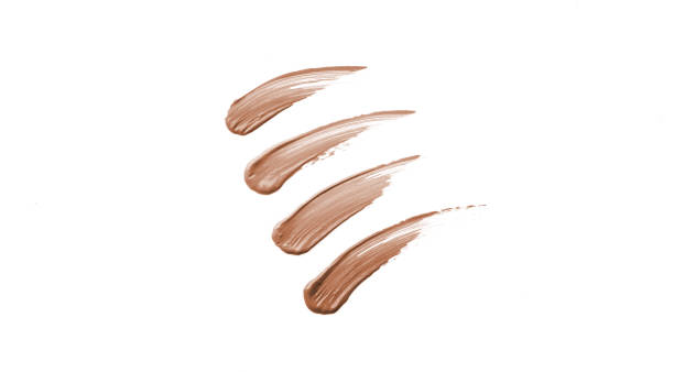 istock Tone cream or foundation, concealer smear stroke smudge isolated on white 1472119780