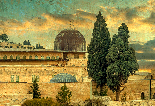 Morning view on ancient Al-Aqsa Mosque, the Mosque is  located in old city of Jerusalem and is the third holiest site of Islam. Textured and toned image for inspiration of retro and vintage style