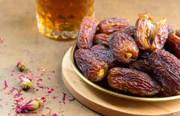 istock Raw Organic Medjool Dates (Kurma in Indonesia). It's also Ramadan Iftar. Ramadan Kareem. Top View. Place for text. 1472123735