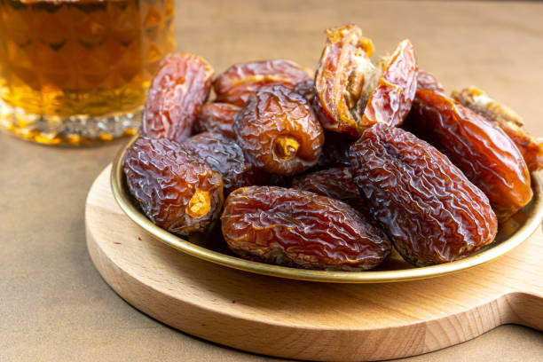 istock Raw Organic Medjool Dates (Kurma in Indonesia). It's also Ramadan Iftar. Ramadan Kareem. Top View. Place for text. 1472123790