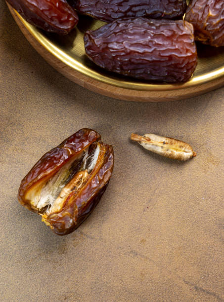 istock Raw Organic Medjool Dates (Kurma in Indonesia). It's also Ramadan Iftar. Ramadan Kareem. Top View. Place for text. 1472123804