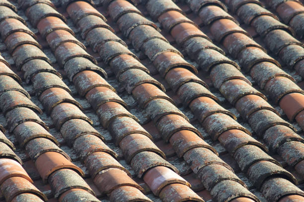 istock Pattern of Orange Tiles on a Roof 1472123952