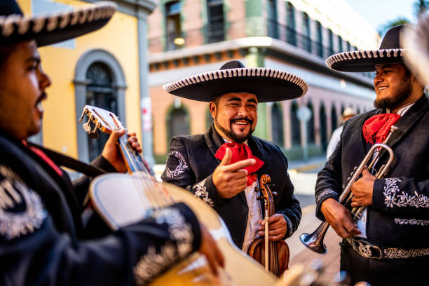 istock Traditional mariachis talking outdoors 1472126695