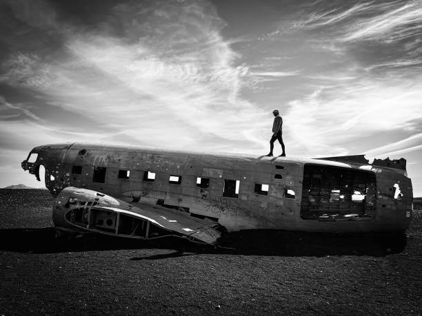 istock Model wolking on airplane black and white photography 1472126974