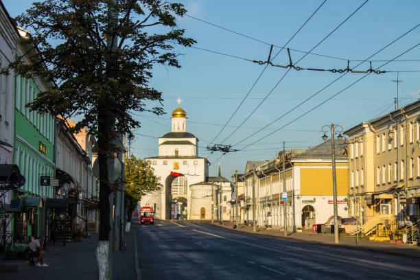 golden gate with a shiny dome in the old town of Vladimir white stone golden gate with a shiny dome in the old town of Vladimir on a sunny summer august day against a blue clear sky golden gate vladimir stock pictures, royalty-free photos & images