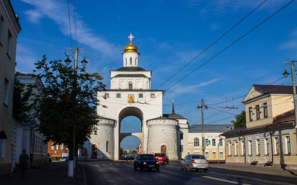 golden gate with a shiny dome in the old town of Vladimir white stone golden gate with a shiny dome in the old town of Vladimir on a sunny summer august day against a blue clear sky golden gate vladimir stock pictures, royalty-free photos & images