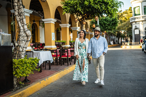 Married couple walking along the historic district