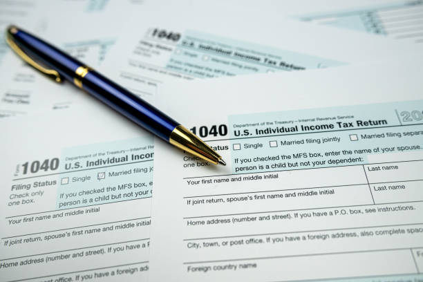 istock pen on blank 1040 Tax Return Form 2022 1472127580