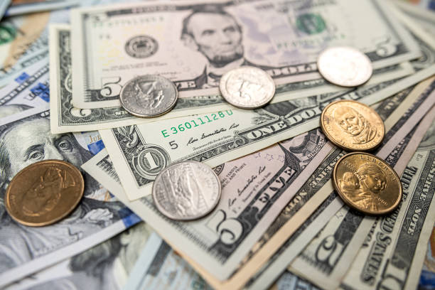 istock different United States dollar bills with coins for background 1472128552