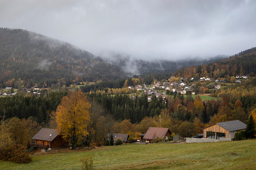 View from the road above Bémont looking accross to Les Xatis in Le Syndicat area of the Vosges in Grand Est France. Autumn view of mist covered mountains and landscape in a popular tourist destination