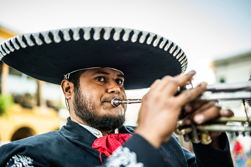 Traditional mariachi trumpeter playing outdoors