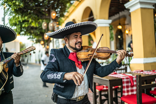 Traditional mariachi violinist playing at the historic district