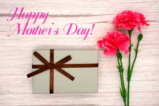 istock Mother's Day carnations and gifts (wood grain background) 1472132657