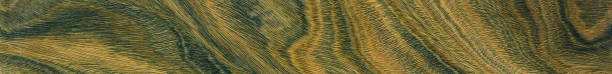 istock Green and brown PaloSanto wooden pattern. 1472133622