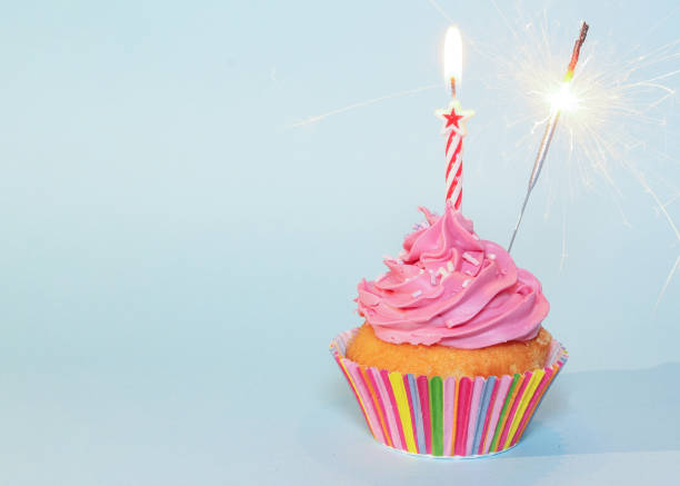 istock Happy Birthday Cupcake for Her with One Candle and Sparkler 1472133727