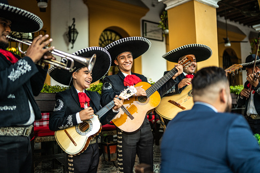 Mariachi band playing at a restaurant outdoors