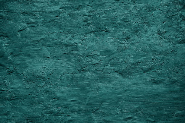 istock Dark green blue uneven texture. Painted old wall. Teal color. Grunge surface background. Rough. 1472134338