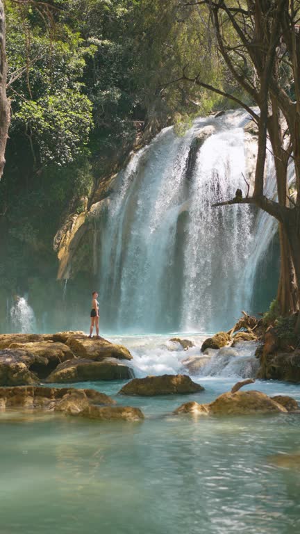 Woman standing near  El Chiflon waterfall in Chiapas, Mexico