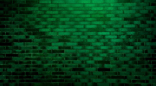 istock abstract green brick wall texture used as background, brick wall texture for design. empty, old, green brick background with copy space. product showcase spotlight background with green neon light. 1472139370