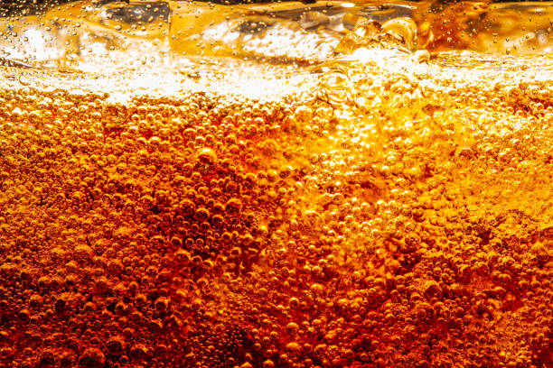 istock macro cola background,Cola background with ice and bubbles 1472139943