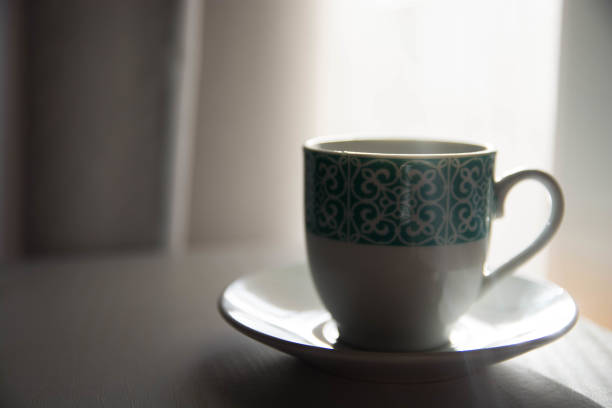 istock Cup of coffee with ray of light. Copy space. 1472140989