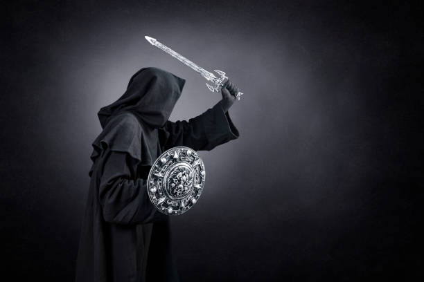 istock Dark knight with sword and shield over dark misty background 1472141570