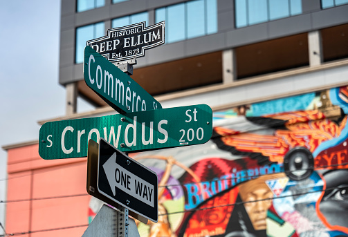 Dallas, Texas, USA - November 13, 2021:  Deep Ellum entertainment district road sign in the downtown core of the city of Dallas Texas USA he's known for a street murals, galleries, bars and concert venues