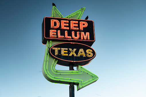 Dallas, Texas, USA - November 13, 2021:  Deep Ellum entertainment district neon sign in the downtown core of the city of Dallas Texas USA he's known for a street murals, galleries, bars and concert venues